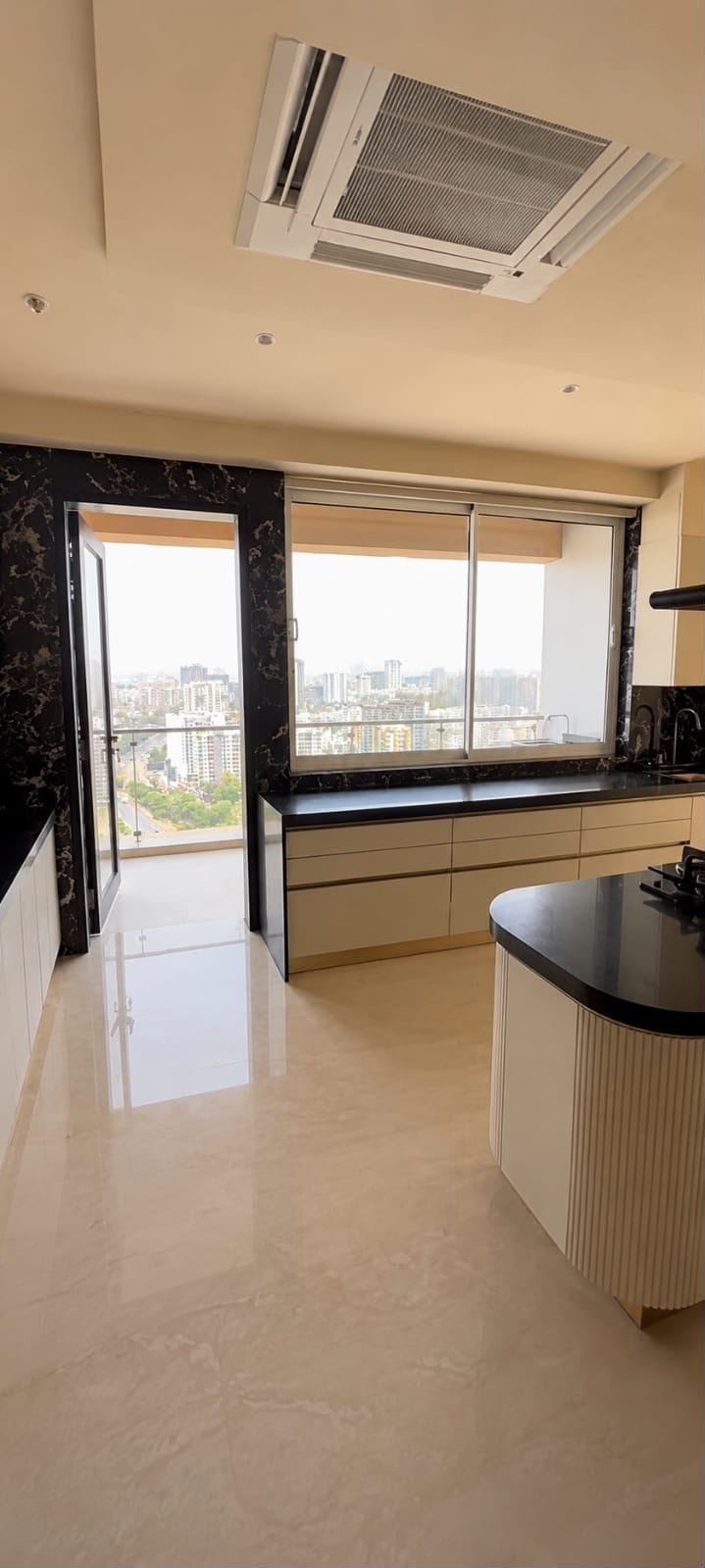 Kitchen view opening toward a balcony
