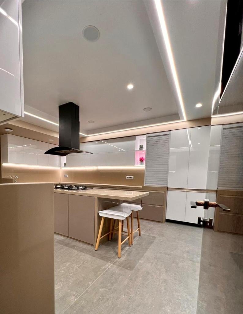Kitchen island connected to dining space