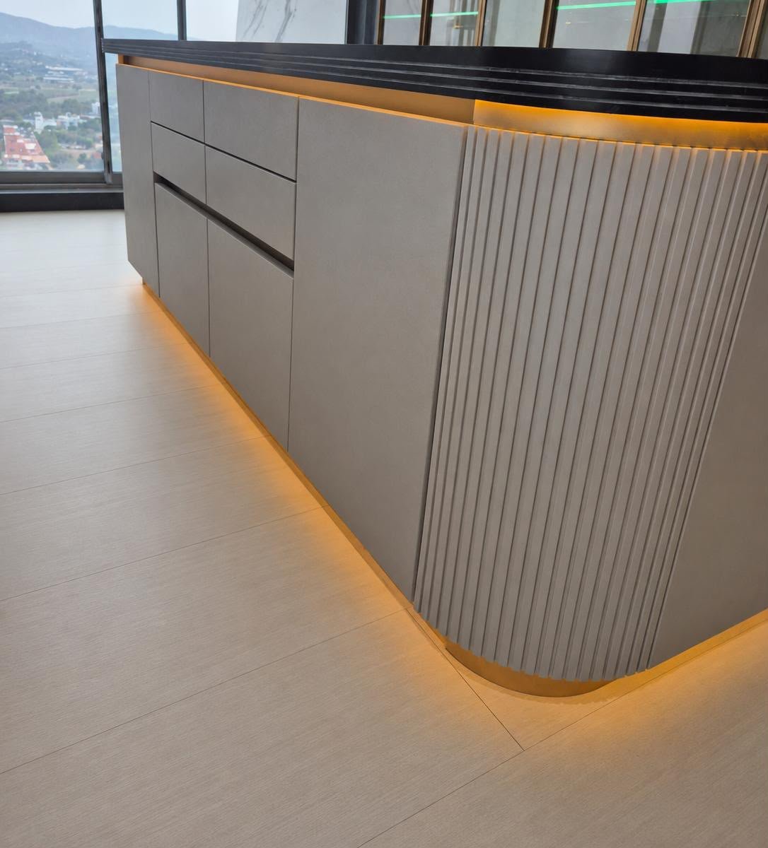 Fluted island cabinet detail with warm lighting